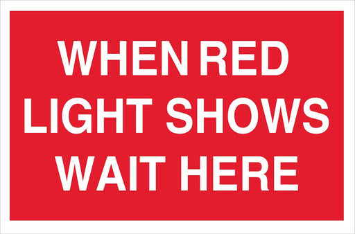 WHEN RED LIGHT SHOWS WAIT HERE